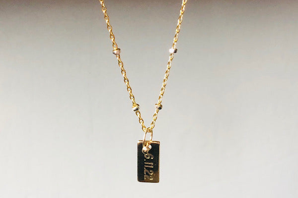 date tag necklace